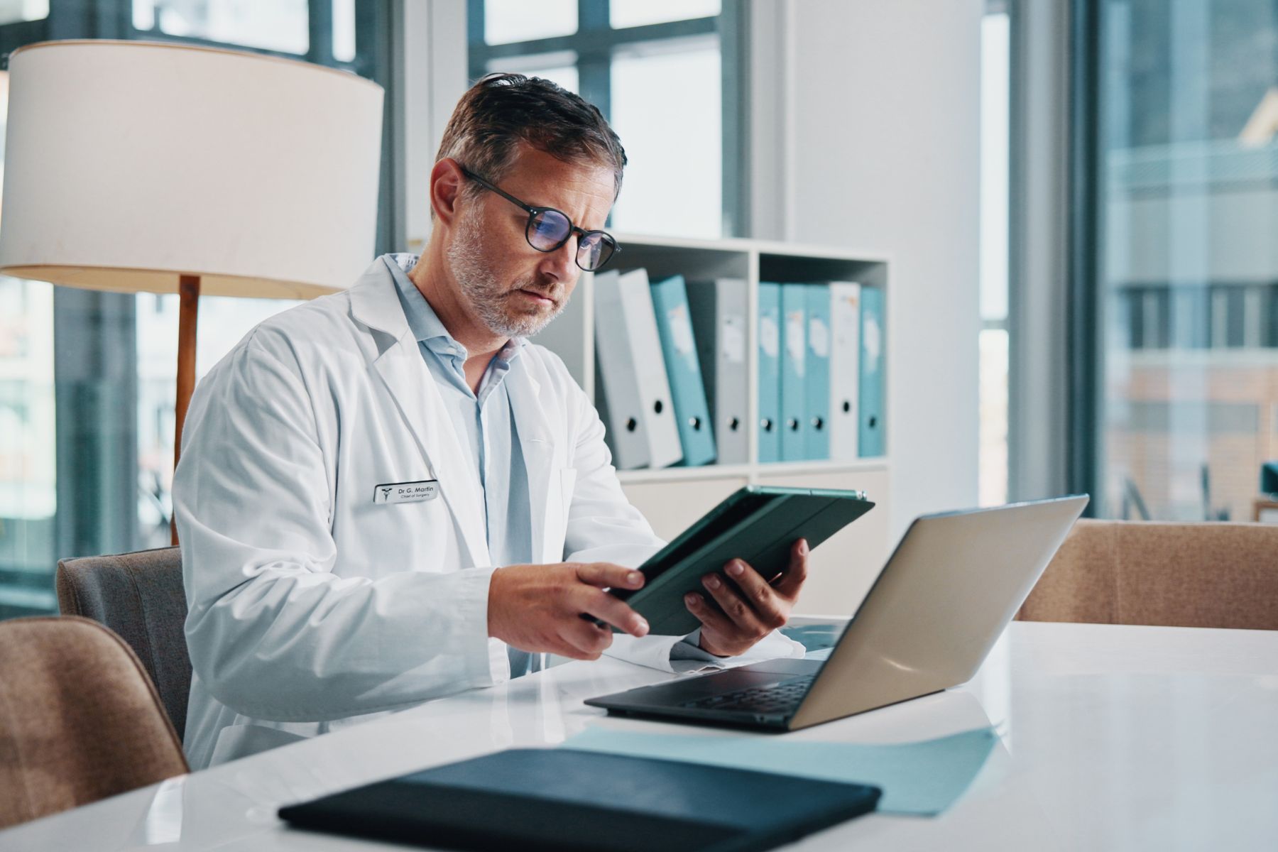 Healthcare professional reviewing wound care evidence and clinical documentation